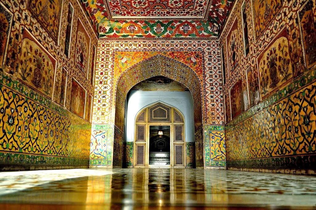 Intricate Mughal frescoes and tile work inside Lahore Fort near Art Galleries Lahore.